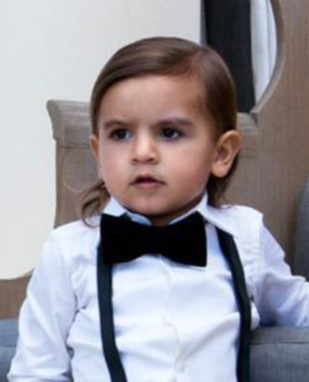 Mason Disick nephew of Kim Kardashian wears a sideparted medium wavy 